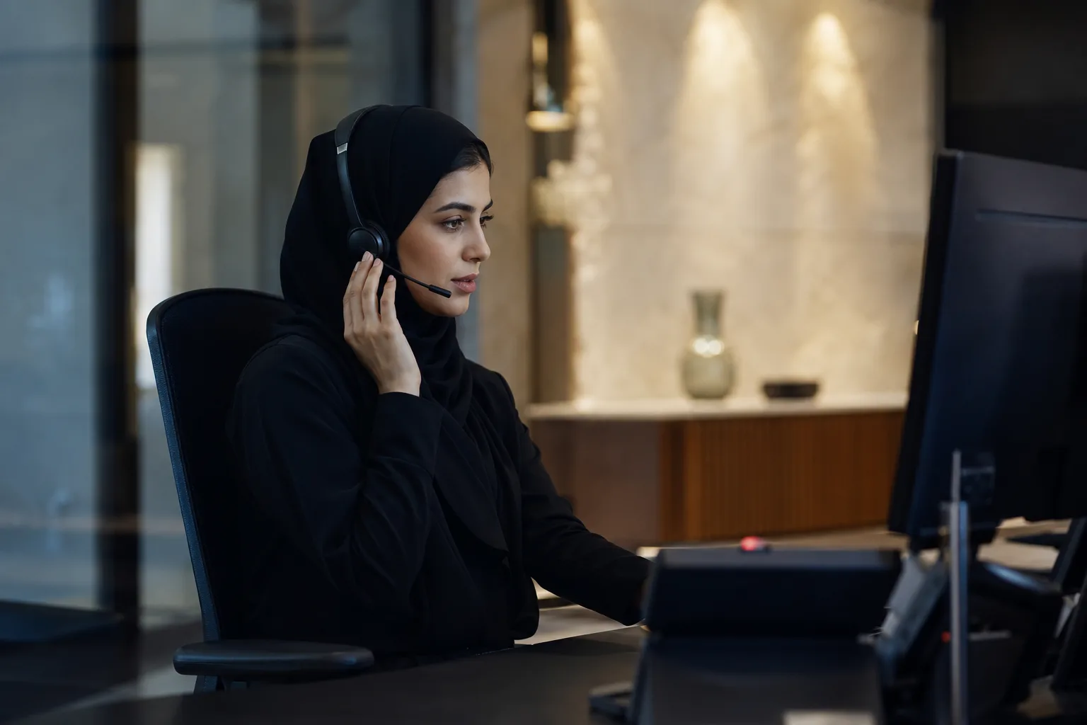 A financial services professional at a discreet workstation